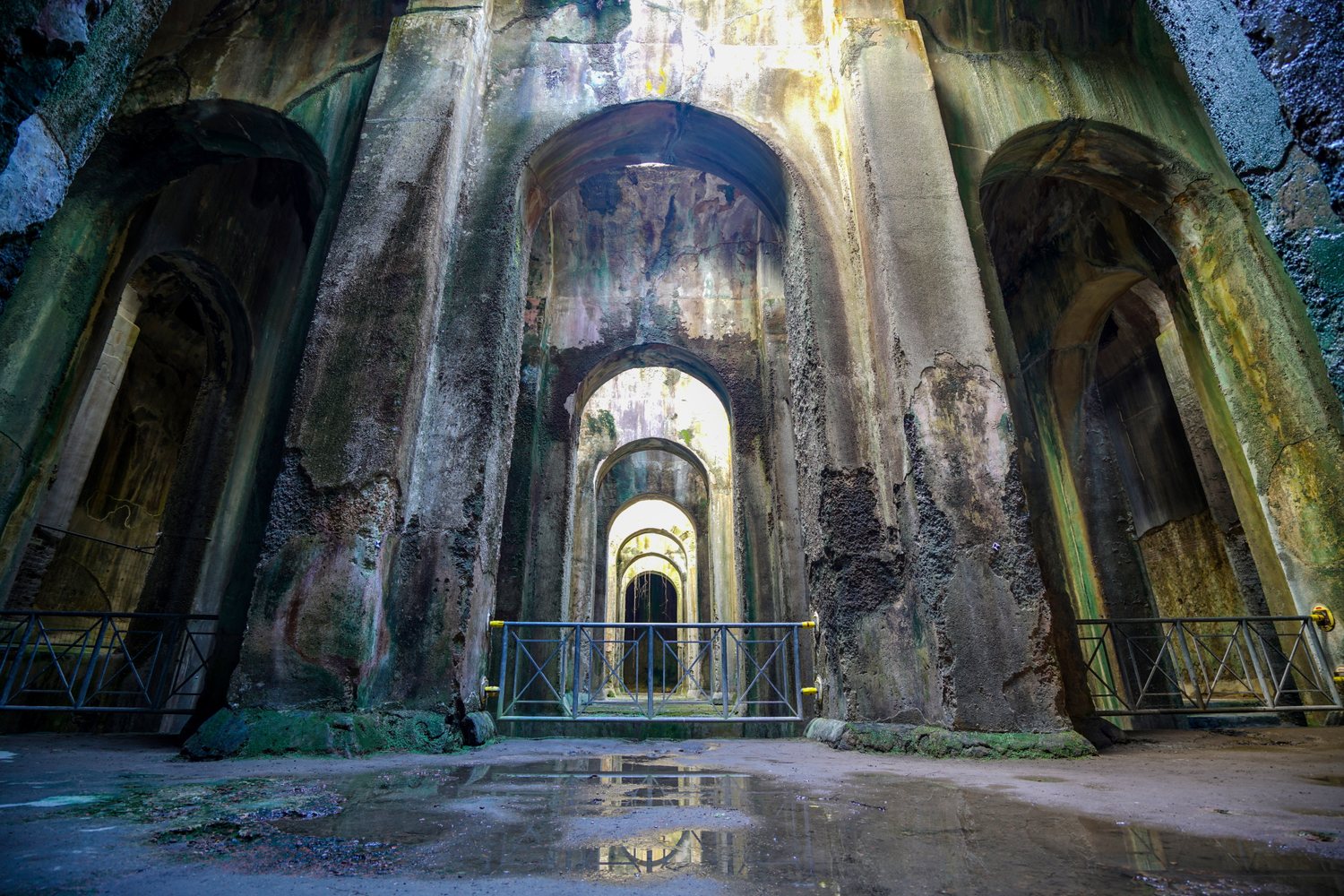 Inside the Piscina Mirabilis at Bacoli — the vast Roman cistern with towering pillars and arched naves that once supplied the imperial fleet at Misenum